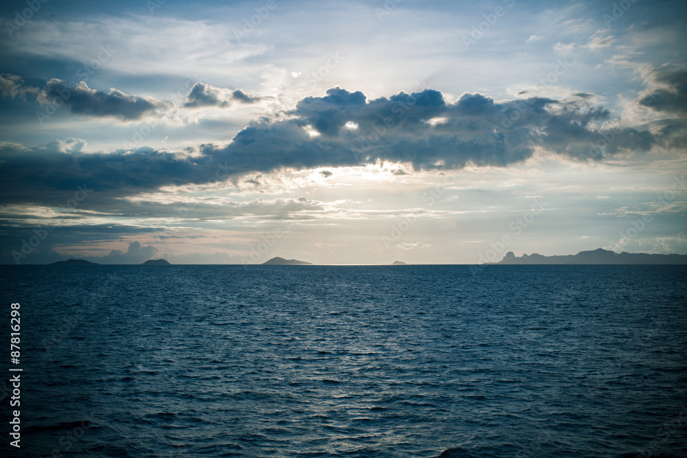 Panoramic dramatic sunset sky and tropical sea at dusk Panoramic dramatic sunset sky and tropical sea at dusk