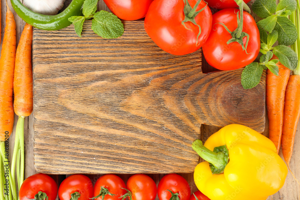 Fresh vegetables with cutting board, top view Fresh vegetables with cutting board, top view