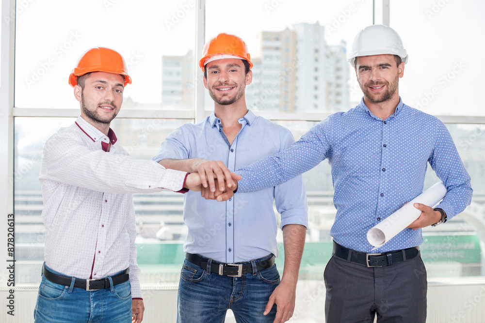 Cheerful construction crew is ready to work Cheerful construction crew is ready to work