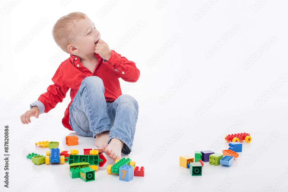 Cheerful male child is having fun with someone Cheerful male child is having fun with someone
