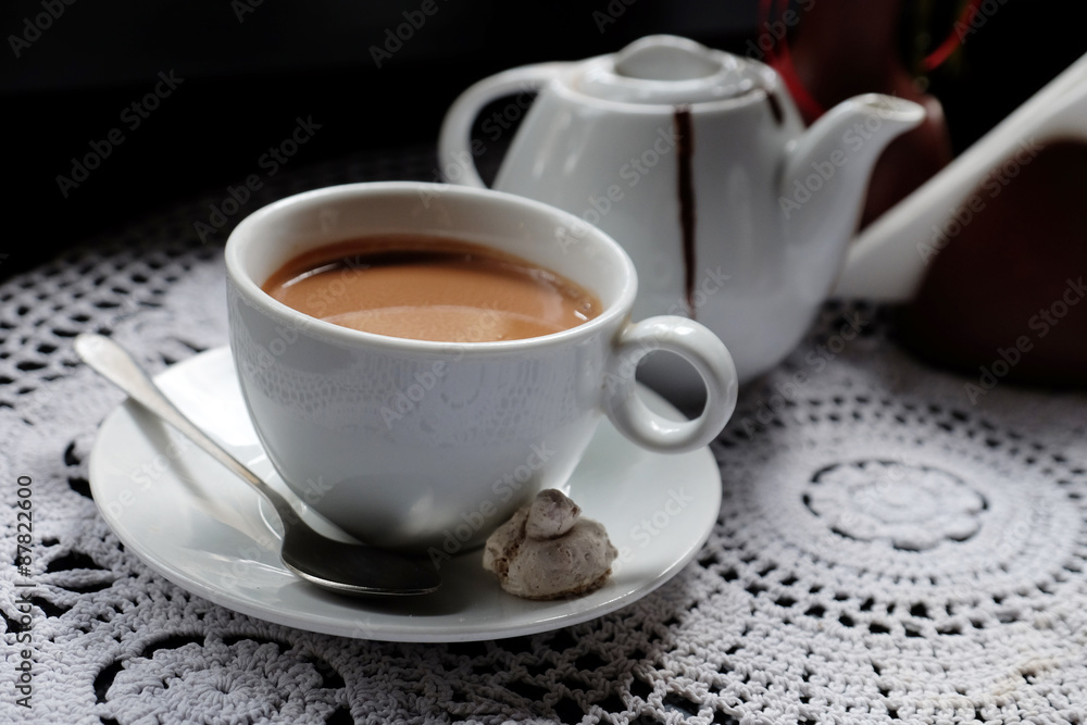 Hot chocolate in mug, on table, on dark background Hot chocolate in mug, on table, on dark background