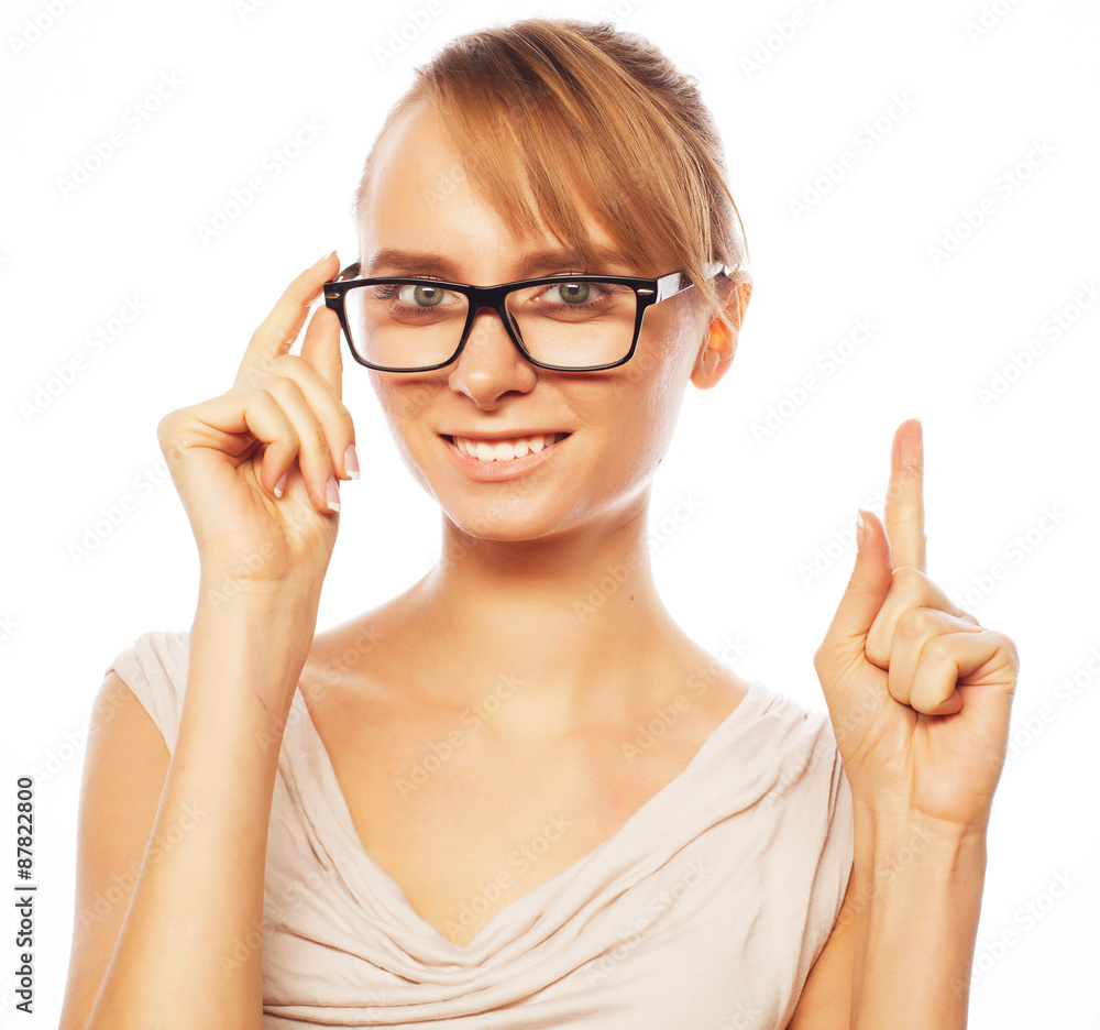 woman wearing glasses pointing up woman wearing glasses pointing up