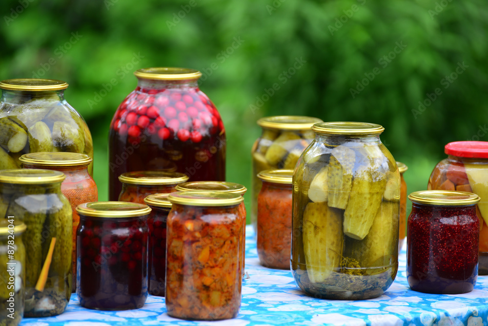 Home canned vegetables in the garden in summer Home canned vegetables in the garden in summer