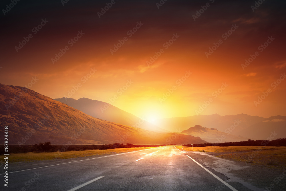Sunrise above road