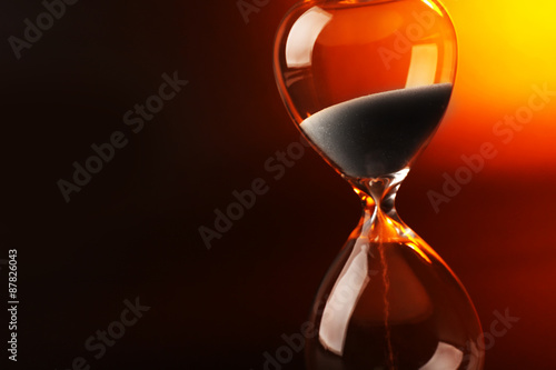 Hourglass on dark color background