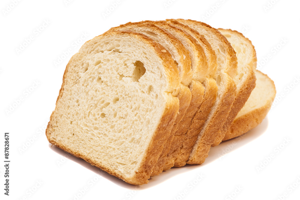 The cut loaf of bread isolated on white The cut loaf of bread isolated on white