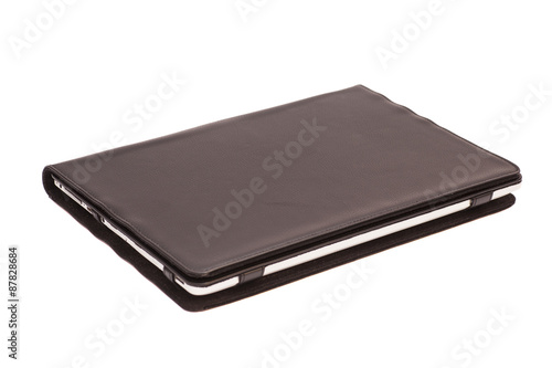 Tablet computer in cover isolated on white