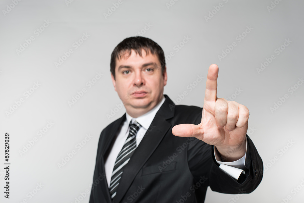 Businessman points finger