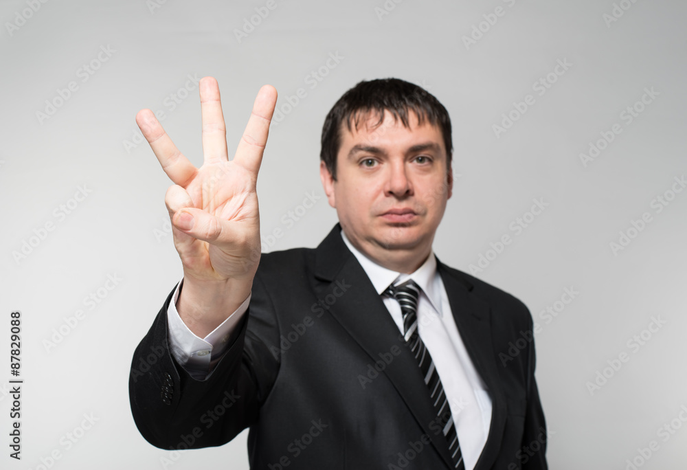 businessman showing three fingers businessman showing three fingers
