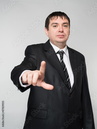 Businessman points finger