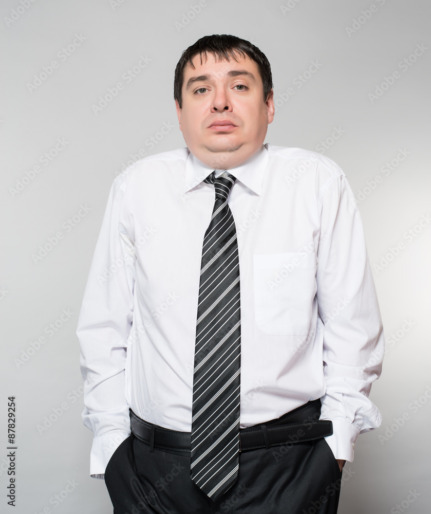 portrait of a young businessman hand on gray background portrait of a young businessman hand on gray background