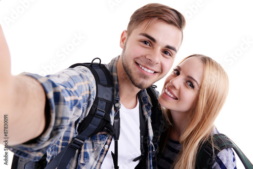 Pair of travelers taking se...