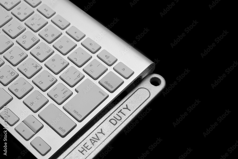 Wrench With Heavy Duty Sign And Wireless Keyboard Isolated Wrench With Heavy Duty Sign And Wireless Keyboard Isolated