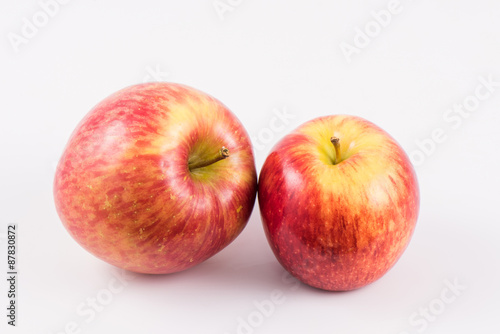 Two red apple on white background