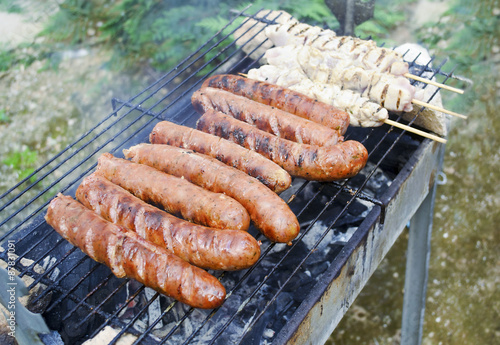 sausages and chicken on the grill