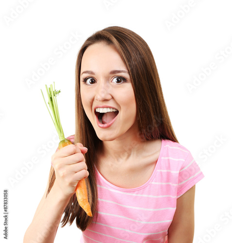 Healthy young woman with carrot isolated on white