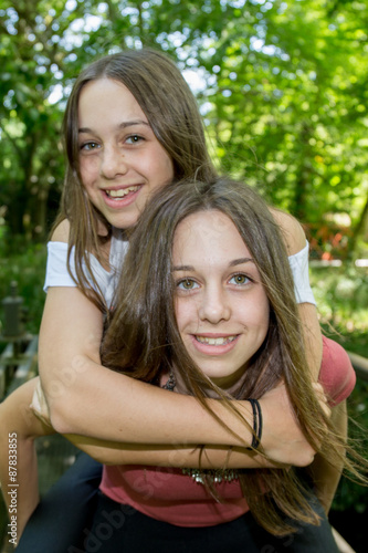 complicity of two sisters in the summer outside