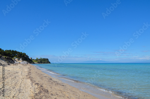 Long white sand beach along the translucent turquoise Mediterran