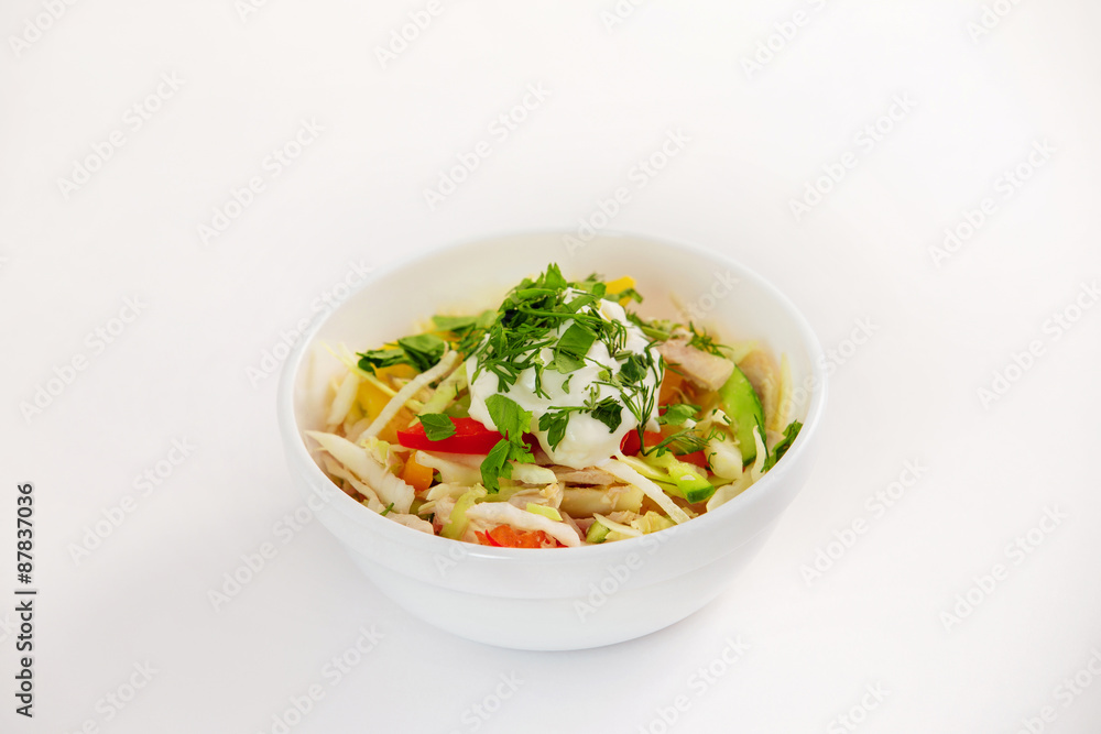 Bowl of fresh summer sliced vegetables salad with cream isolated Bowl of fresh summer sliced vegetables salad with cream isolated