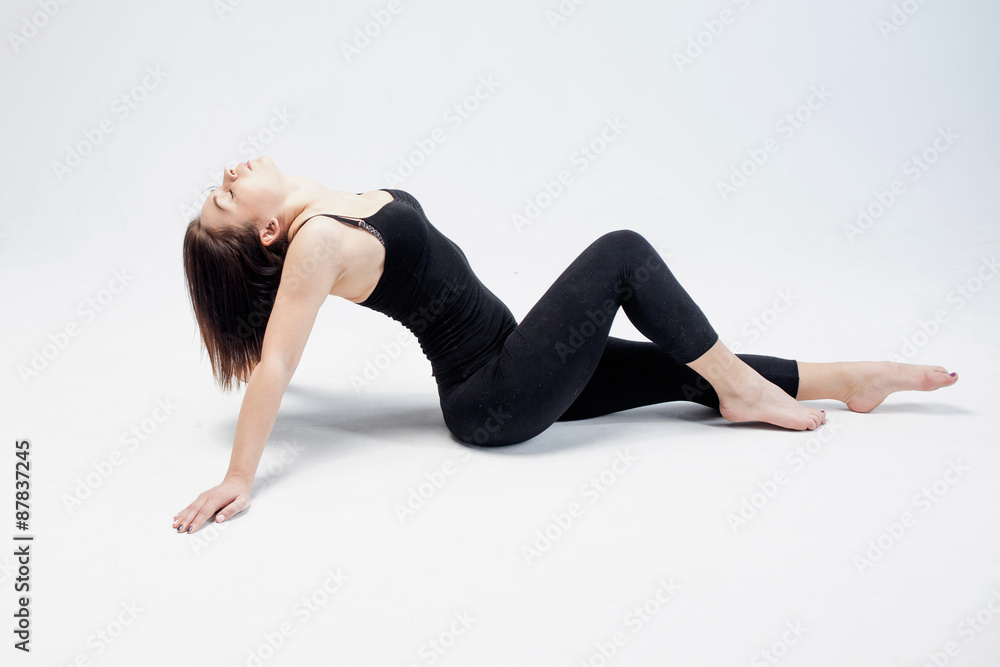 athletic girl posing in Studio, place for your text on the right athletic girl posing in Studio, place for your text on the right