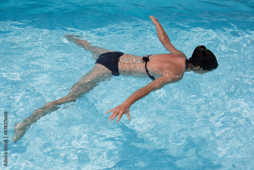 Female swimmer in an outdoor swimming pool
