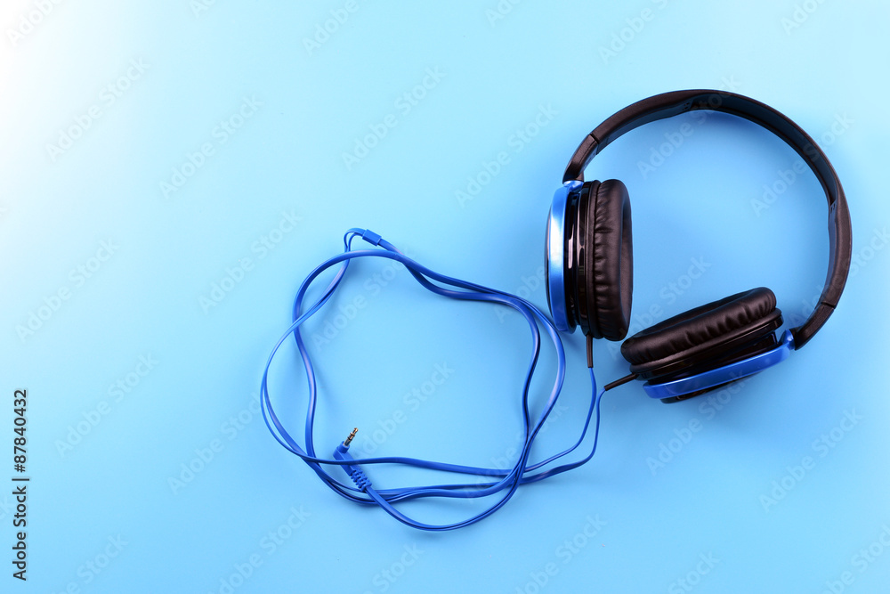 Headphones on blue background Headphones on blue background