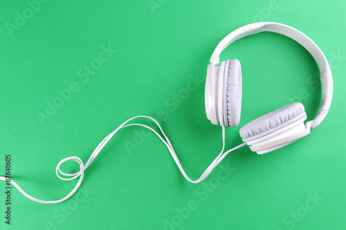 Headphones on green background