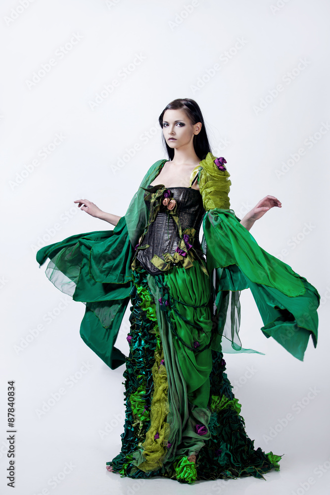Fashion photo  young magnificent woman in green dress,  the