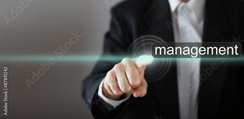 Management Businessman's hand pressing the icon on virtual screen