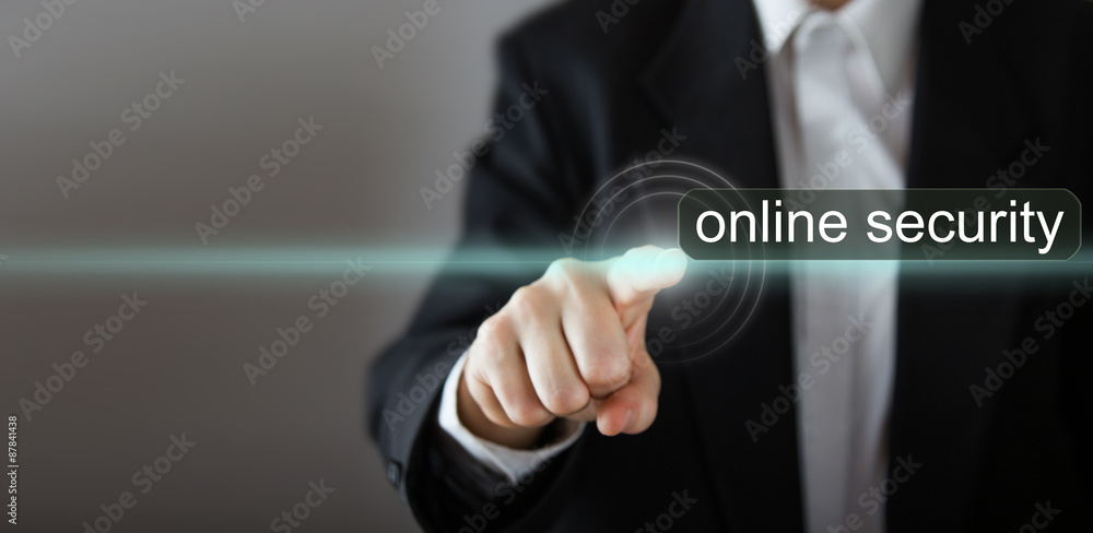 Online security Businessman's hand pressing the icon on virtual screen Online security Businessman's hand pressing the icon on virtual screen