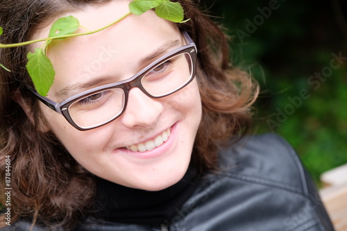 smiling woman in leaves