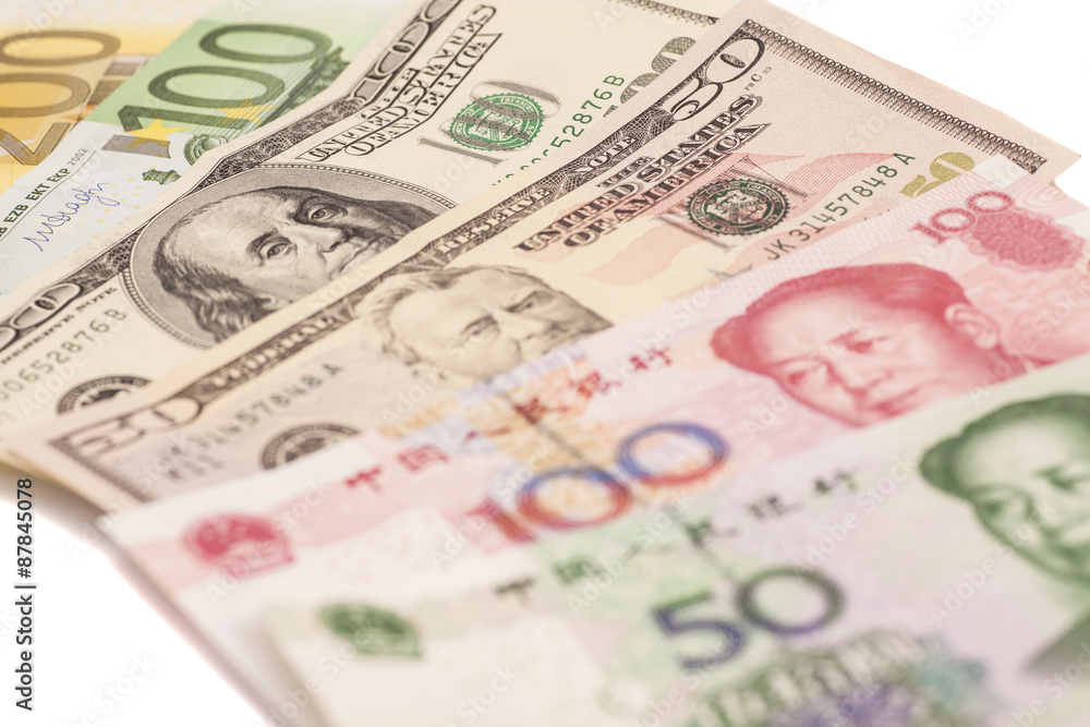 American dollars, European euro and Chinese yuan bills American dollars, European euro and Chinese yuan bills