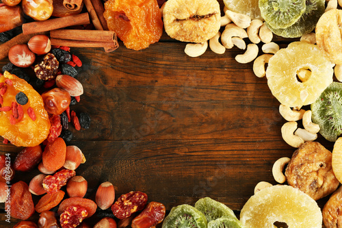 Assortment of dried fruits on wooden table, closeup