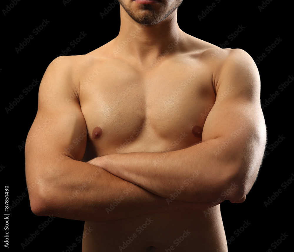 Muscle young man on dark background Muscle young man on dark background