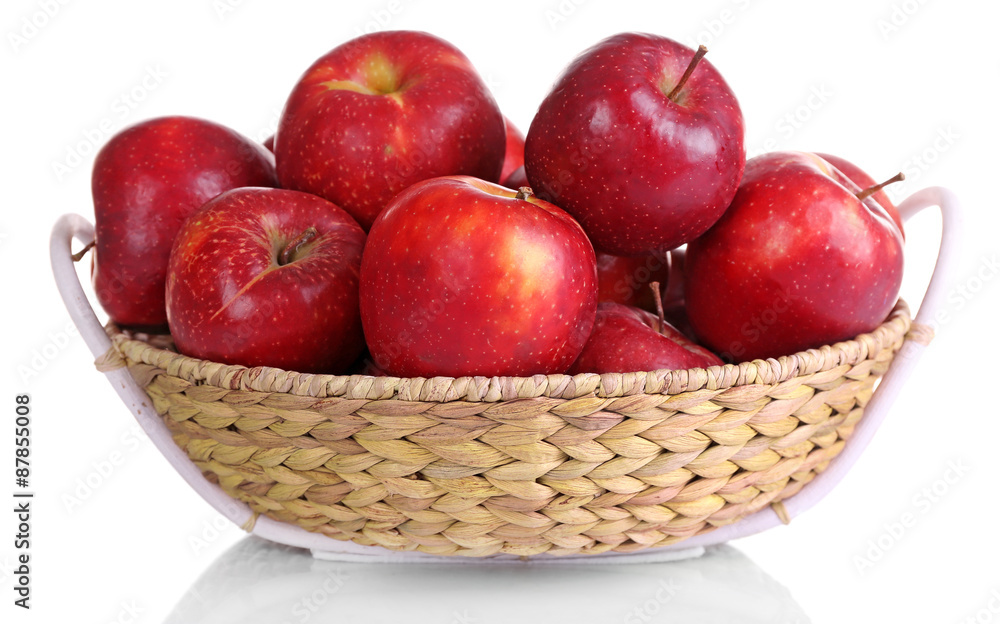Ripe red apple in wicker basket isolated on white Ripe red apple in wicker basket isolated on white