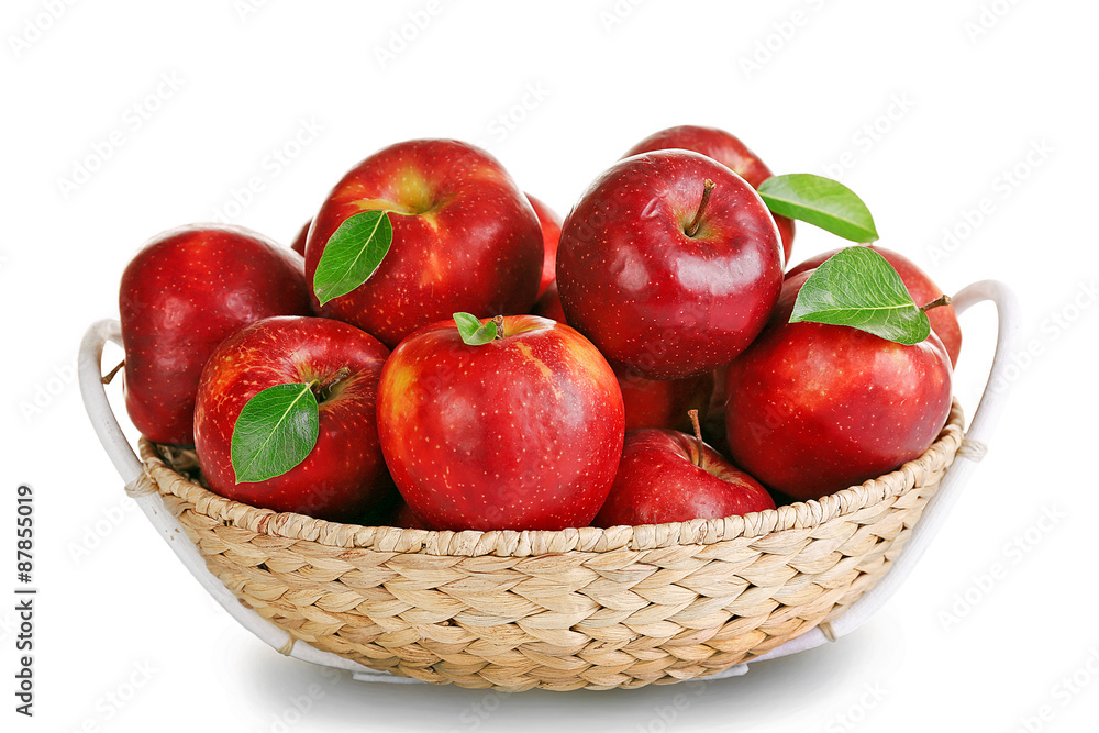 Ripe red apple in wicker basket isolated on white Ripe red apple in wicker basket isolated on white