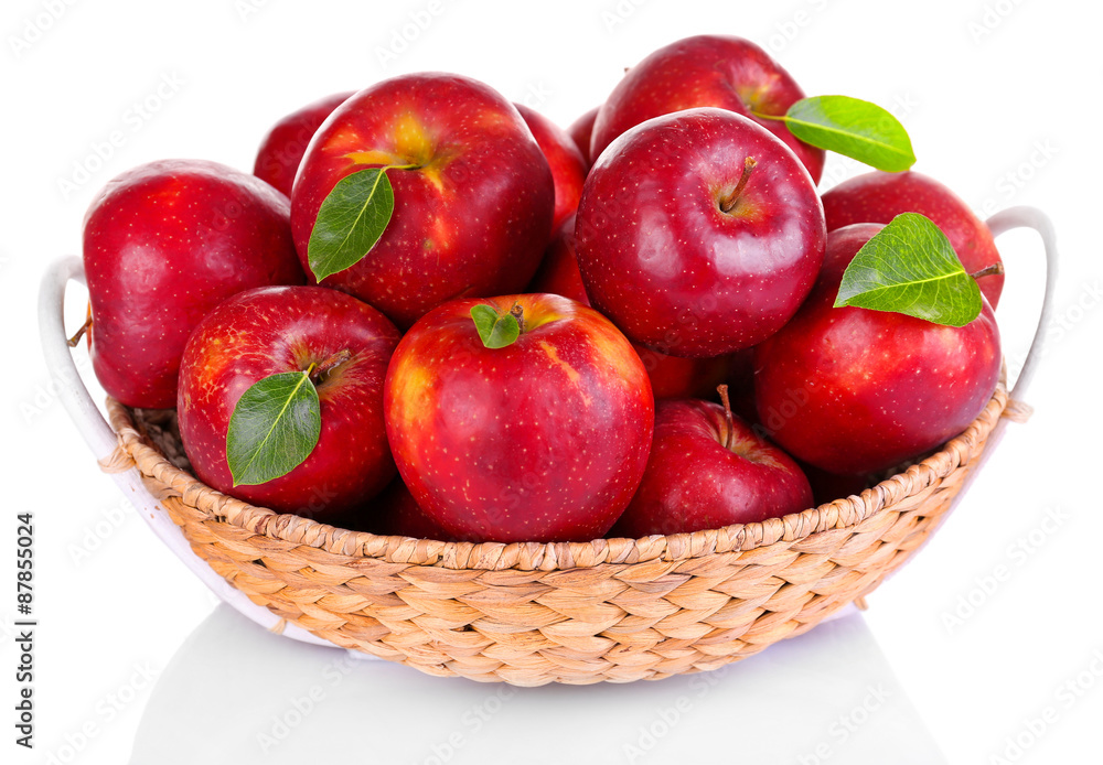 Ripe red apple in wicker basket isolated on white Ripe red apple in wicker basket isolated on white