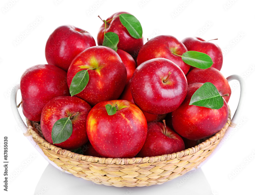 Ripe red apple in wicker basket isolated on white Ripe red apple in wicker basket isolated on white