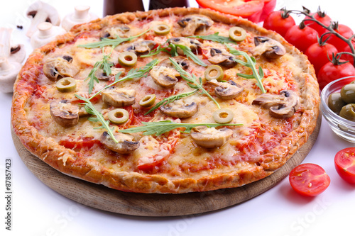 Tasty pizza with vegetables and arugula close up