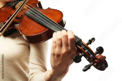 Violinist playing violin isolated on white