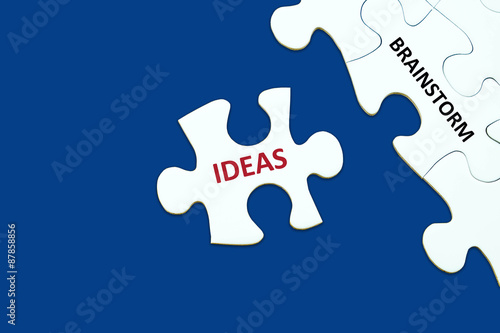 Brainstorm and ideas words on jigsaw puzzle background