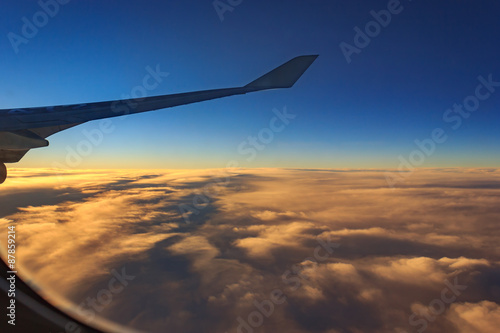 aircraft wing with cloudy