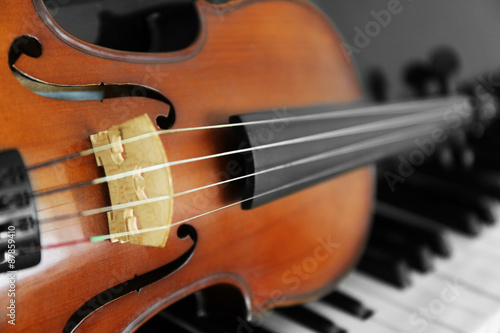 Violin on piano keys, closeup