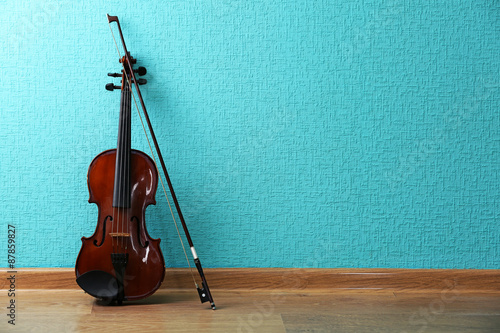 Photography Classical violin on turquoise wallpaper background