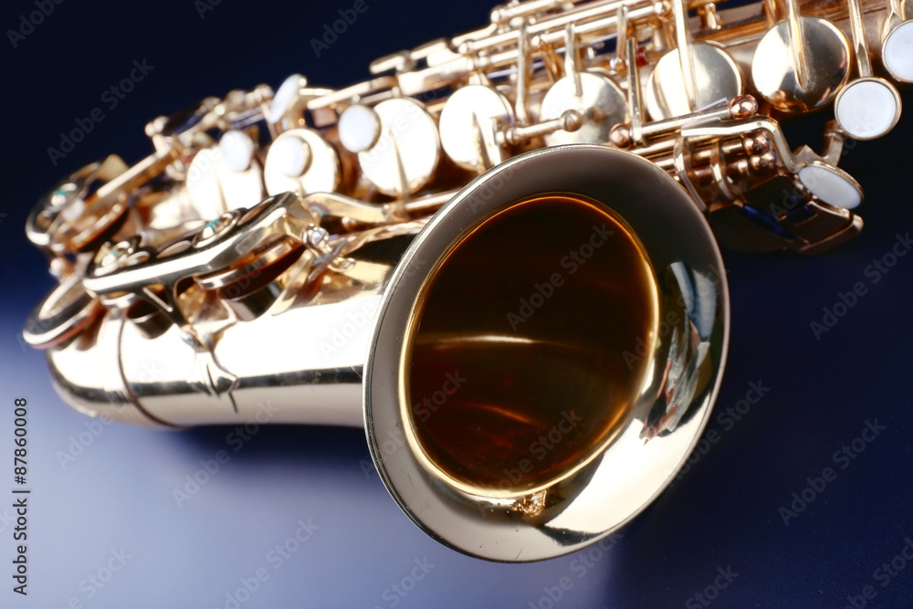 Fototapeta premium Golden saxophone on dark background