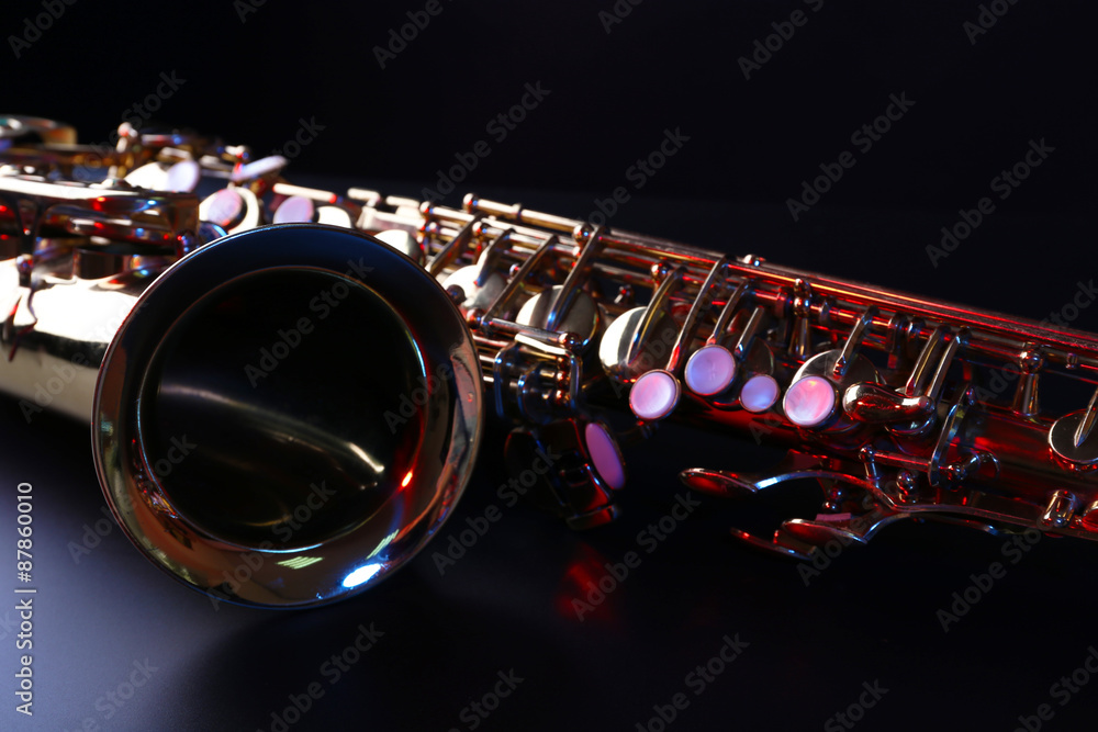 Fototapeta premium Golden saxophone on dark background