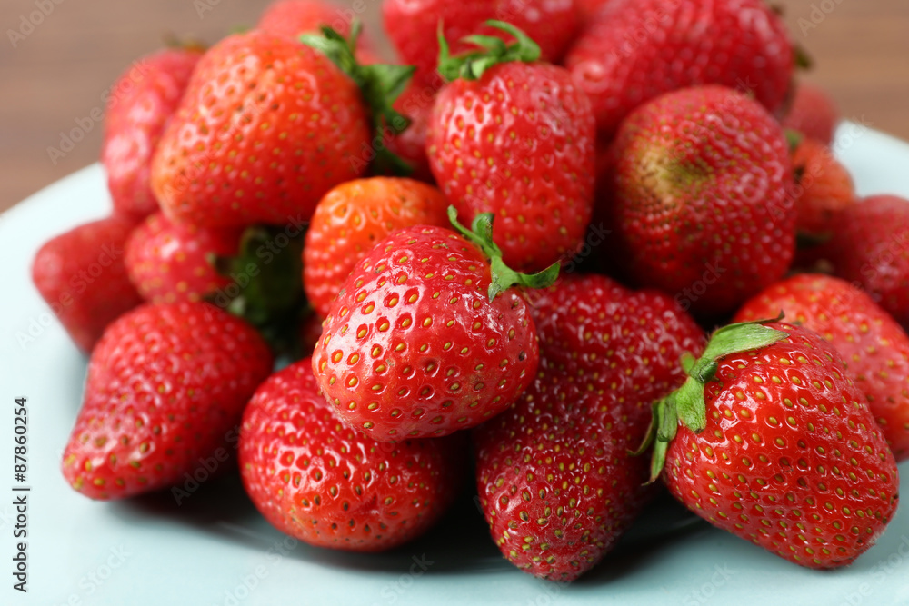 Ripe strawberries in plate, closeup Ripe strawberries in plate, closeup