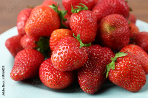 Ripe strawberries in plate  closeup