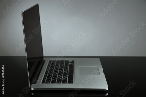 Fototapeta Naklejka Na Ścianę i Meble -  Laptop on gray background