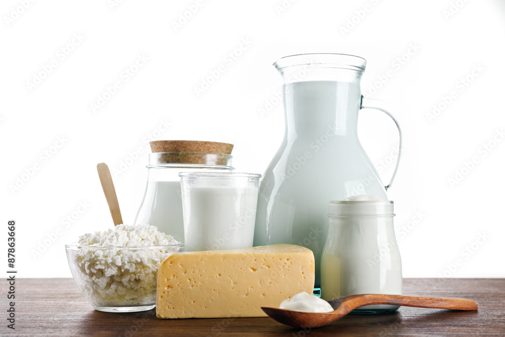 Dairy products on wooden table on white background Dairy products on wooden table on white background